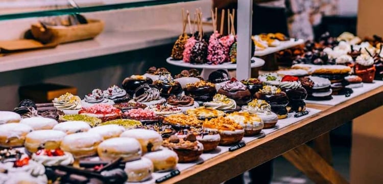 Chris standing up holding his daughter Elva